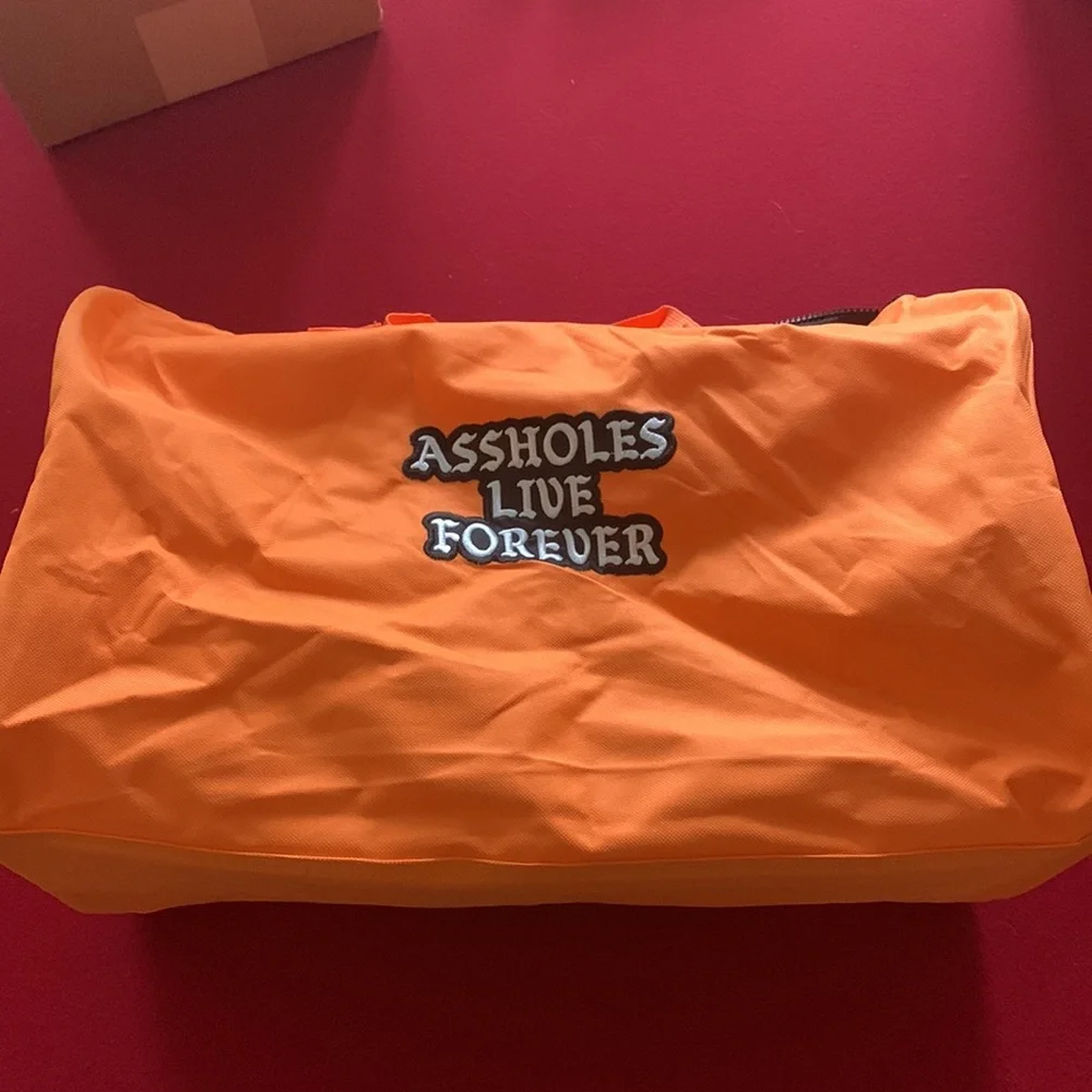 Assholes live forever Linda finegold duffel bag in orange